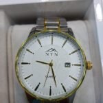 Elegant men's chronograph watch with black dial and metal strap.