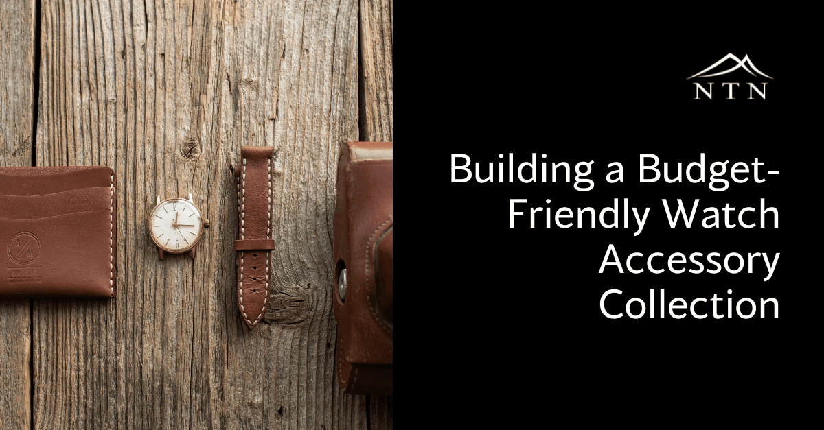 Elegant leather watch and wallet with strap on wood surface.