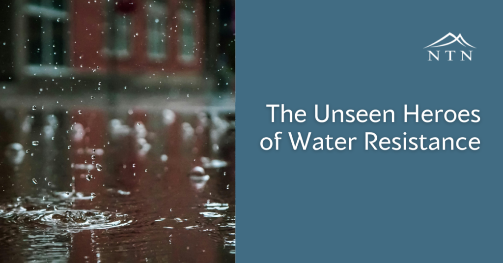 Water droplets falling, showcasing water-resistant technology.