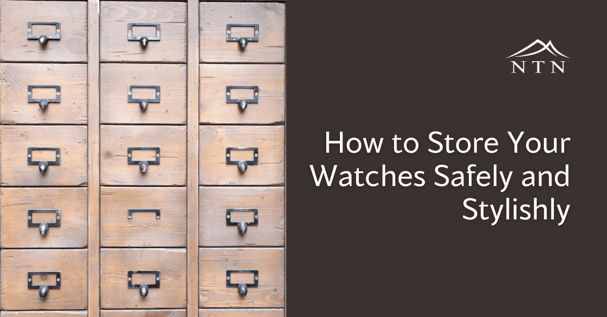Well-organized wooden watch storage with vintage-style drawers and pull handles.