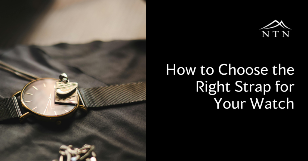 Close-up of a stylish watch with a black strap laid on fabric, showcasing different strap options for watches.