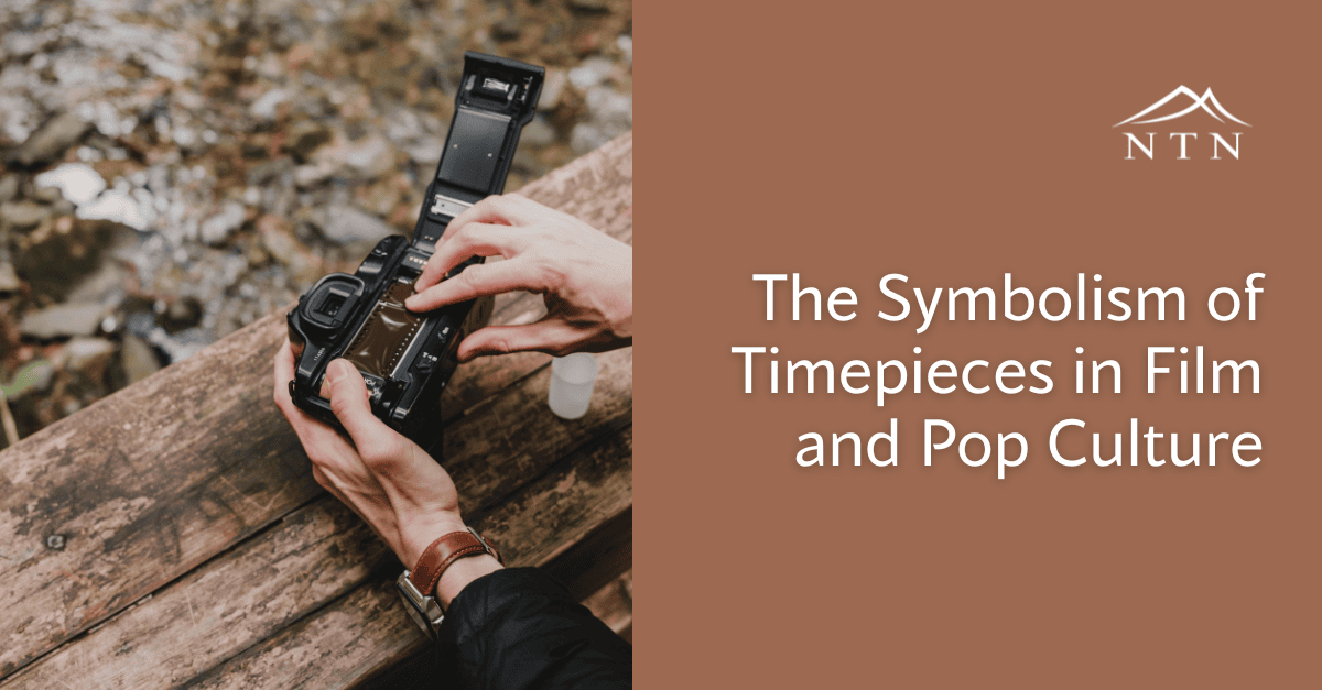 Hand holding a camera with a clock symbol, symbolizing timepieces in film.