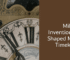 Detailed close-up of an antique clock face with Roman numerals and intricate craftsmanship.