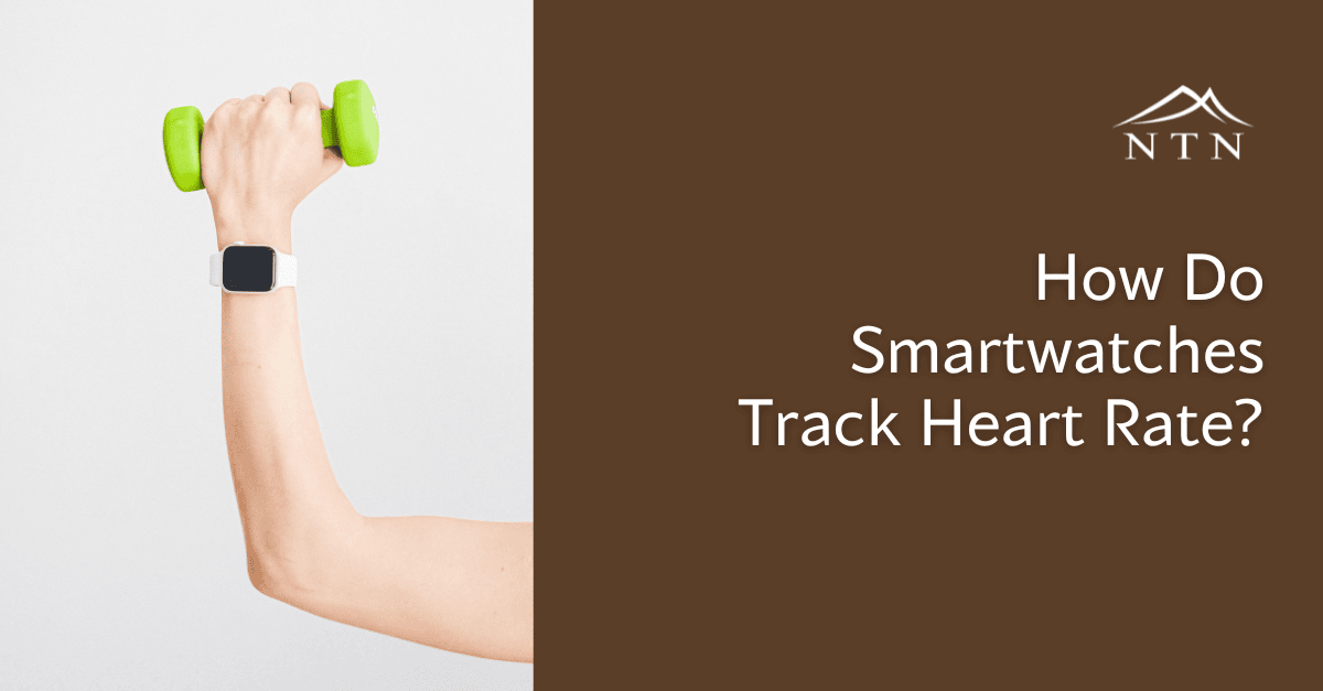 Smartwatch with heart rate monitor showing on wrist.