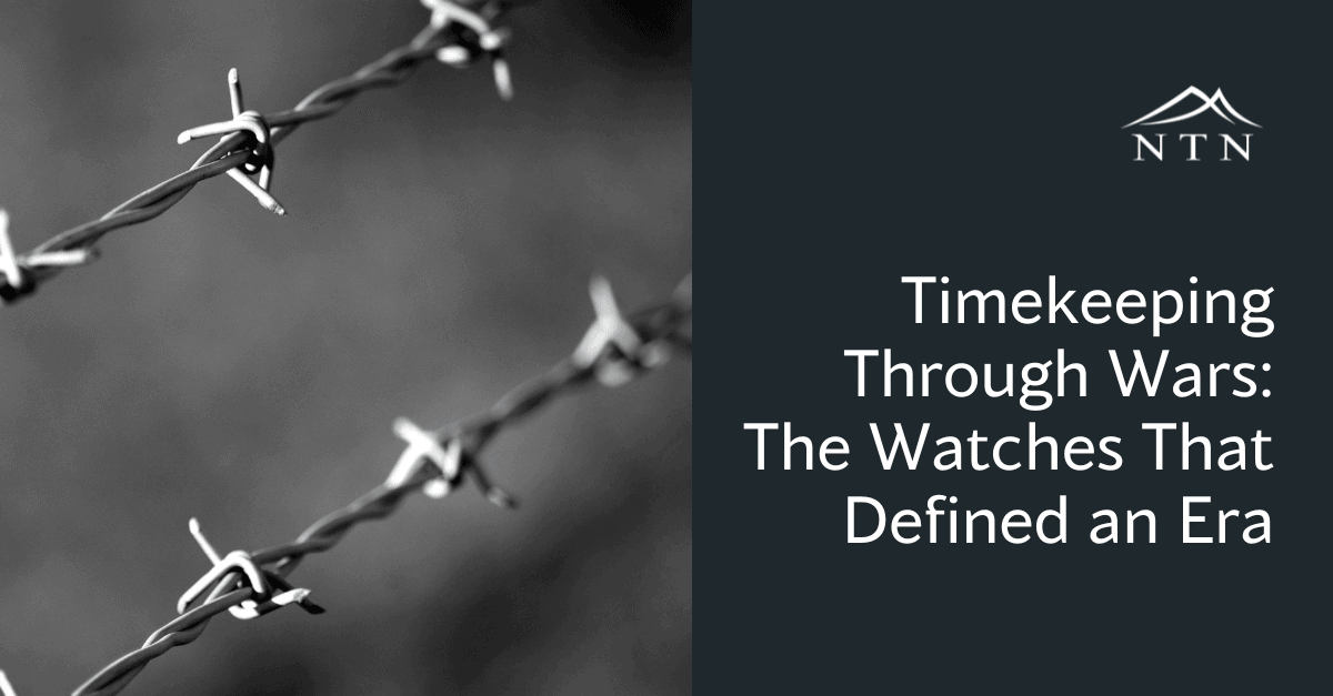 Close-up of barbed wire on dark background, emphasizing wartime surveillance and protection strategies.