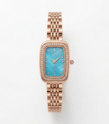 Elegant NTN quartz watch with blue dial and rose gold band.