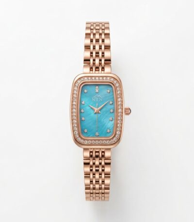 Elegant NTN quartz watch with blue dial and rose gold band.